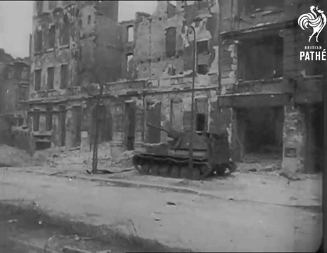 A Black And White Photo Of A Destroyed City With The Pathe Logo On The Bottom GIF
