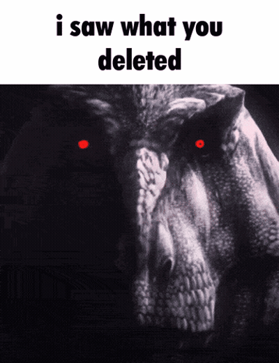 A Black And White Photo Of A Dinosaur With Red Eyes And The Words " I Saw What You Deleted " GIF