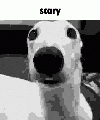 A Black And White Photo Of A Dog With Its Mouth Open And The Word Scary Written Above It . GIF