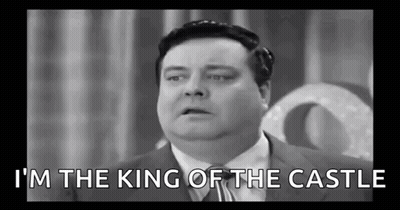 A Black And White Photo Of A Fat Man In A Suit And Tie Talking . GIF