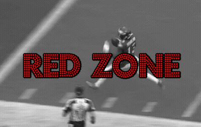 A Black And White Photo Of A Football Game With The Words Red Zone In Red Letters GIF