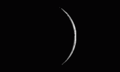 A Black And White Photo Of A Full Moon On A Black Background GIF