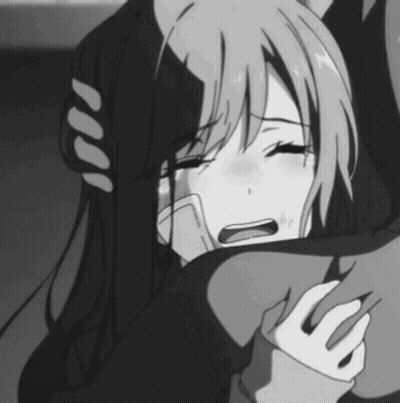 A Black And White Photo Of A Girl Crying While Hugging A Man . GIF