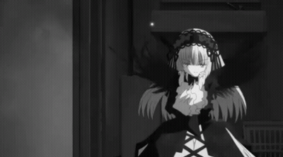 A Black And White Photo Of A Girl In A Gothic Outfit GIF