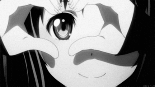 A Black And White Photo Of A Girl Looking Through Her Hands . GIF