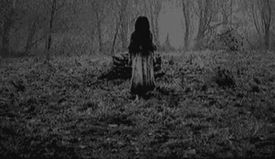 A Black And White Photo Of A Girl With A Ring On Her Finger . GIF
