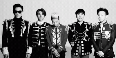 A Black And White Photo Of A Group Of Men In Military Uniforms Standing Next To Each Other GIF