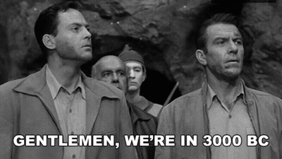 A Black And White Photo Of A Group Of Men With Gentlemen We 'Re In 3000 Bc Written Below Them GIF