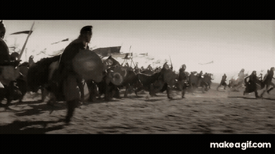 A Black And White Photo Of A Group Of Soldiers Fighting In A Field . GIF