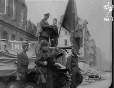 A Black And White Photo Of A Group Of Soldiers Holding A Flag GIF