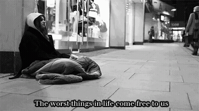 A Black And White Photo Of A Homeless Person With The Words " The Worst Things In Life Come Free To Us " Above Them GIF
