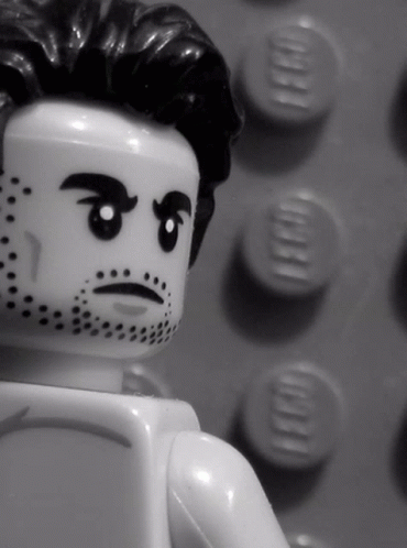 A Black And White Photo Of A Lego Man GIF