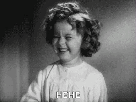A Black And White Photo Of A Little Girl Laughing GIF