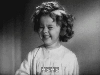 A Black And White Photo Of A Little Girl Laughing GIF