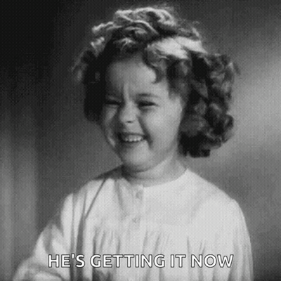 A Black And White Photo Of A Little Girl Laughing . GIF