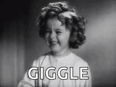 A Black And White Photo Of A Little Girl Laughing With The Word Giggle In The Background . GIF