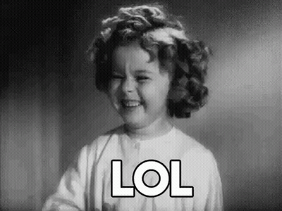 A Black And White Photo Of A Little Girl Laughing With The Word Lol . GIF