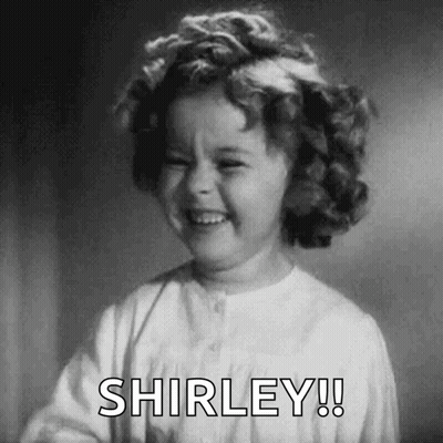 A Black And White Photo Of A Little Girl Laughing With The Words Shirley ! GIF
