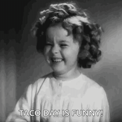 A Black And White Photo Of A Little Girl Laughing With The Words Taco Day Is Funny . GIF