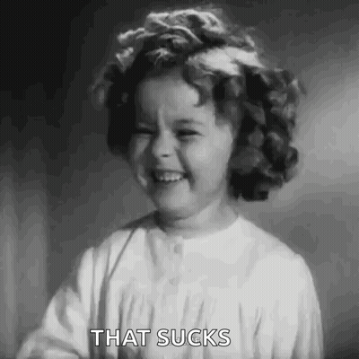 A Black And White Photo Of A Little Girl With A Flower In Her Hair . GIF