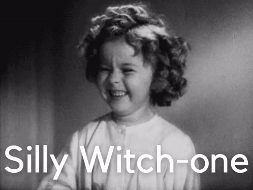 A Black And White Photo Of A Little Girl With The Words Silly Witch-One Behind Her GIF