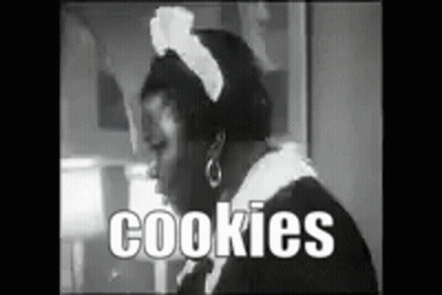 A Black And White Photo Of A Maid With The Words Cookies Written In White Letters GIF