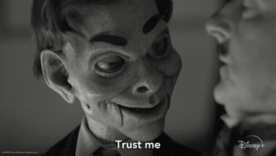A Black And White Photo Of A Man And A Puppet That Says " Trust Me " GIF