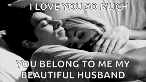 A Black And White Photo Of A Man And A Woman Hugging Each Other . GIF