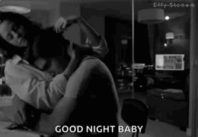 A Black And White Photo Of A Man And A Woman Hugging Each Other . GIF