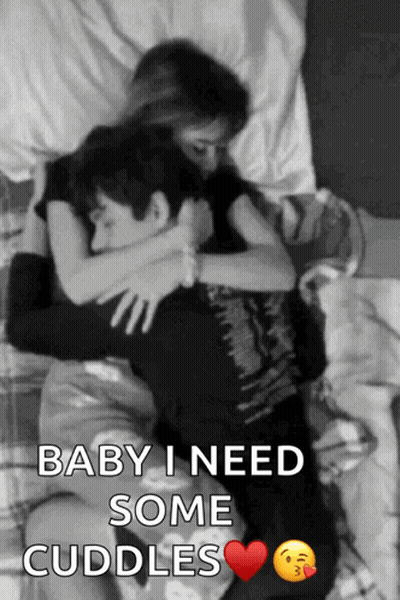 A Black And White Photo Of A Man And A Woman Hugging With The Caption Baby I Need Some Cuddles GIF