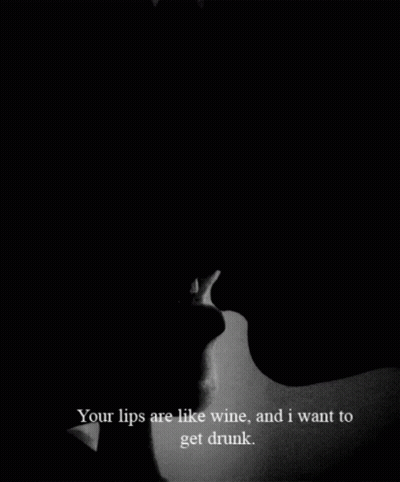 A Black And White Photo Of A Man And A Woman Kissing With The Caption Your Lips Are Like Wine And I Want To Get Drunk GIF