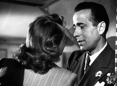 A Black And White Photo Of A Man And A Woman GIF