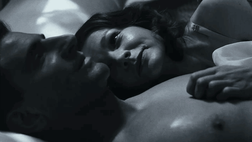 A Black And White Photo Of A Man And A Woman GIF