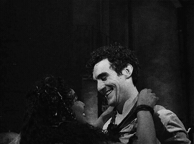 A Black And White Photo Of A Man And A Woman GIF