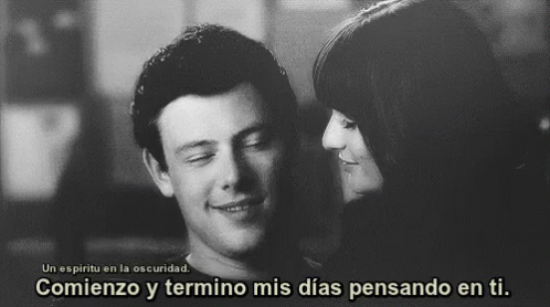 A Black And White Photo Of A Man And A Woman With A Caption In Spanish GIF