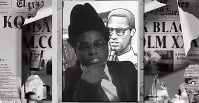 A Black And White Photo Of A Man And A Woman With A Newspaper That Says Lm X GIF