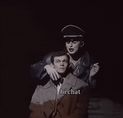 A Black And White Photo Of A Man And A Woman With The Words Hi Chat Below Them GIF