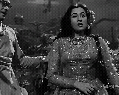 A Black And White Photo Of A Man And A Woman With The Words Shemel On The Bottom GIF