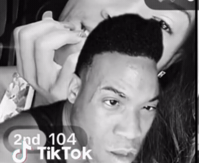 A Black And White Photo Of A Man And A Woman With Tiktok Written On The Bottom GIF