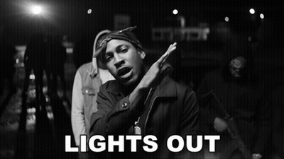 A Black And White Photo Of A Man And The Words Lights Out GIF