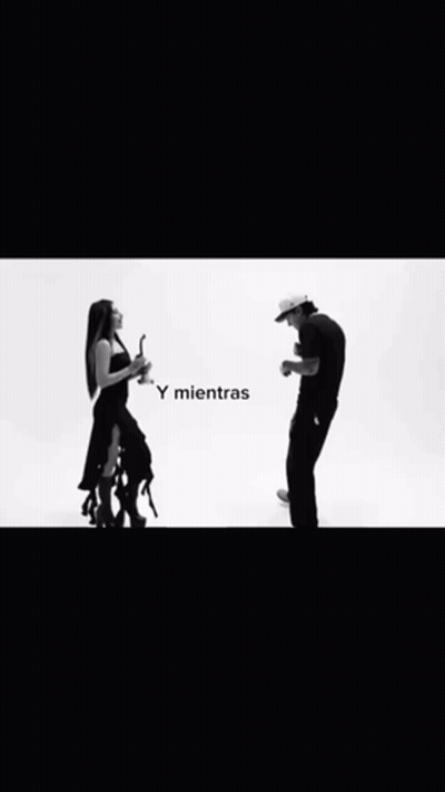 A Black And White Photo Of A Man And Woman GIF