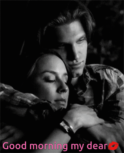 A Black And White Photo Of A Man And Woman Hugging With The Words " Good Morning My Dear " GIF