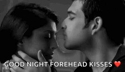 A Black And White Photo Of A Man And Woman Kissing With The Words Good Night Forehead Kisses . GIF