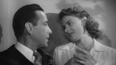 A Black And White Photo Of A Man And Woman GIF