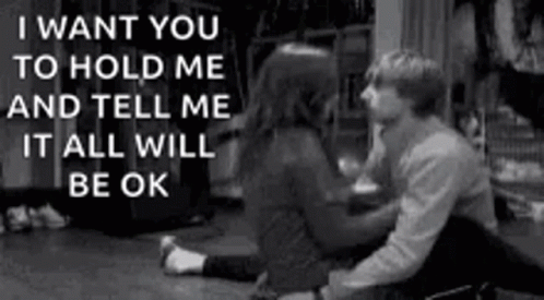 A Black And White Photo Of A Man And Woman Sitting On The Floor With A Quote . GIF