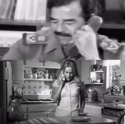 A Black And White Photo Of A Man And Woman Talking On A Phone GIF