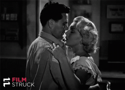 A Black And White Photo Of A Man And Woman With The Words Film Struck On The Bottom Right GIF