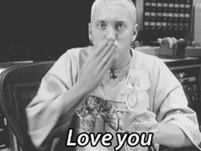 A Black And White Photo Of A Man Covering His Mouth With His Hand And The Words " Love You " Below Him GIF