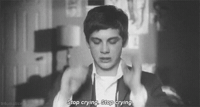 A Black And White Photo Of A Man Crying With The Words `` Stop Crying , Stop Crying . '' GIF