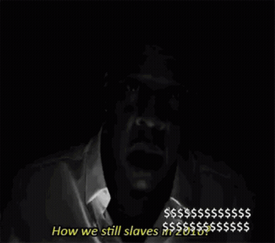 A Black And White Photo Of A Man Holding A Cell Phone In His Hand . GIF